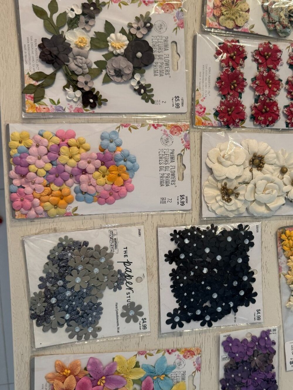 10 packages of fabric floral embellishments, NWT in beautiful colors